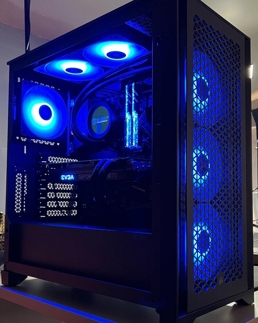 Custom gaming PC build with blue fan lighting in a black case