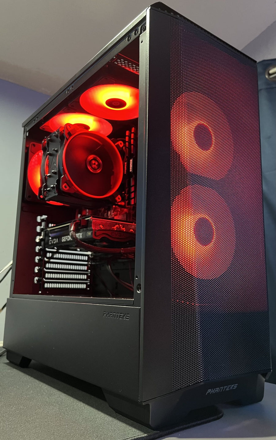 Compact custom gaming PC build with red fan lighting