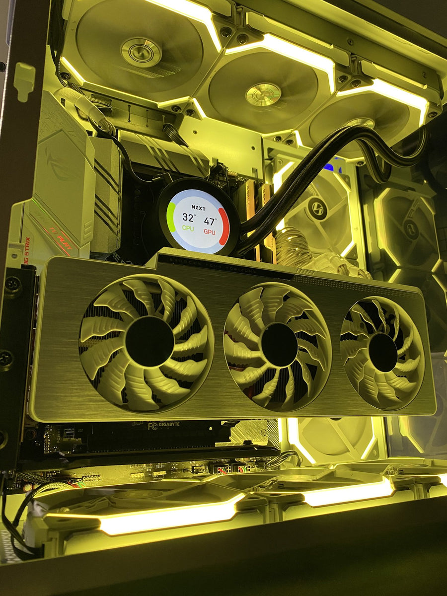Custom gaming PC build with warm yellow lighting and a triple-fan graphics card